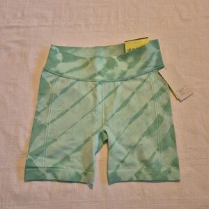 All in motion girls size Large or 10/12 high rise bike shorts multi shade green